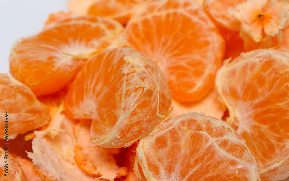 peeled tangerine slices. tangerine segments with selective focus. ready-to-eat tangerines. orange natural food. peeled tangerine slices. tangerine segments with selective focus. ready-to-eat tangerines. orange natural food.