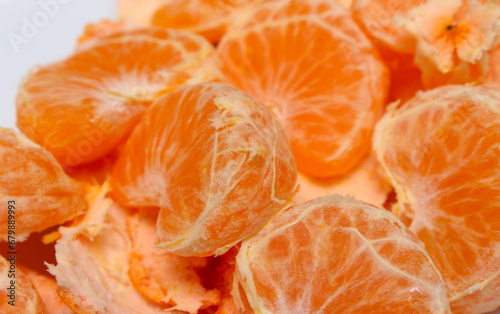peeled tangerine slices. tangerine segments with selective focus. ready-to-eat tangerines. orange natural food.