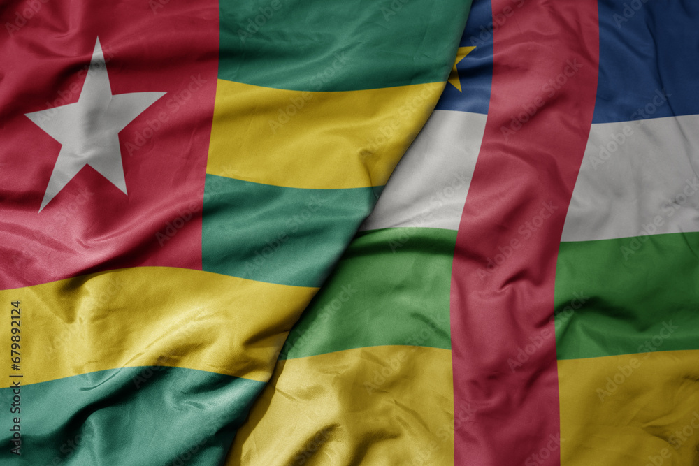 Obraz premium big waving national colorful flag of central african republic and national flag of togo .