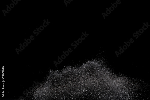 Explosion metallic black glitter sparkle. Dark Glitter powder spark blink celebrate, blur foil explode in air, fly throw black glitters particle. Black background isolated, selective focus Blur bokeh