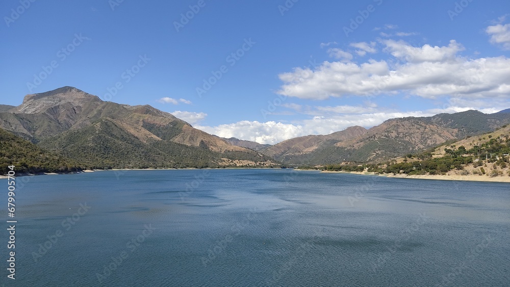 river between mountains and rocks river between mountains and rocks