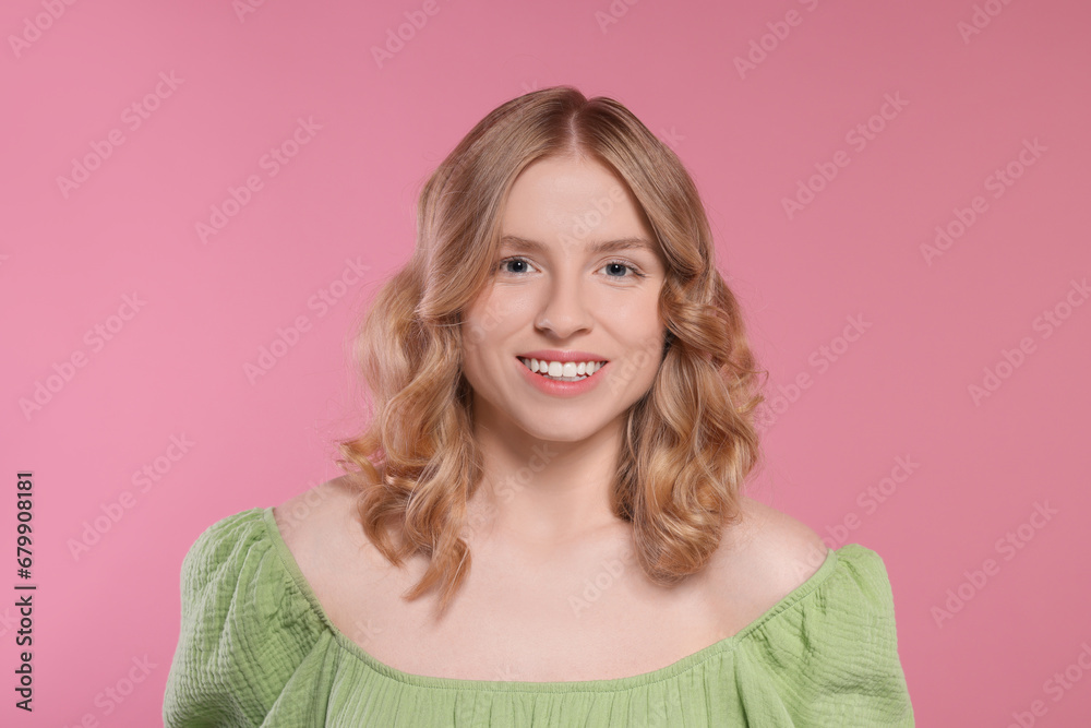 Portrait of beautiful woman with blonde hair on pink background Portrait of beautiful woman with blonde hair on pink background