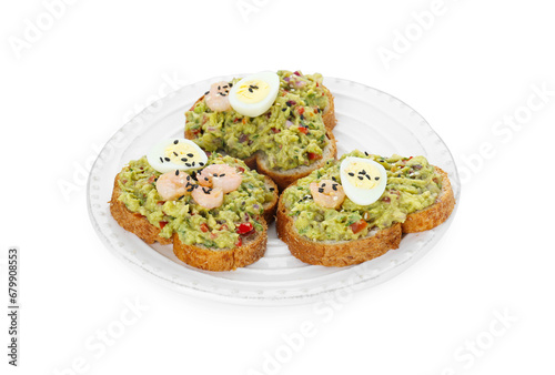 Slices of bread with tasty guacamole and eggs isolated on white