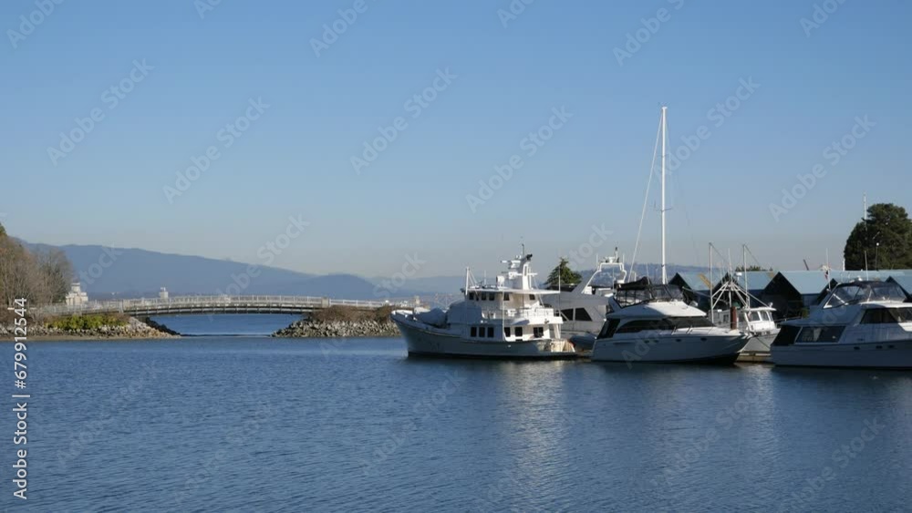 Beautiful view of Stanley Park during a fall season near Deadman's Island and the Royal Vancouver Yacht Club in Vancouver, British Columbia, Canada Beautiful view of Stanley Park during a fall season near Deadman's Island and the Royal Vancouver Yacht Club in Vancouver, British Columbia, Canada
