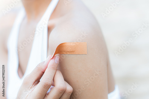 woman arm with an adhesive bandage