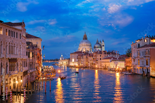 View of Venice Grand Canal with boats and Santa Maria della Salute church in the evening from Ponte dell'Accademia bridge. Venice, Italy © Dmitry Rukhlenko