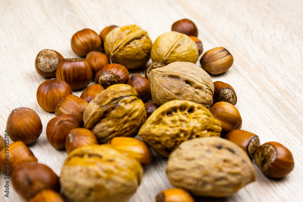 Nuts on the table. Walnut and hazelnut. Natural nuts. Nuts on the table. Walnut and hazelnut. Natural nuts.