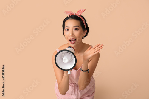 Young Asian woman with mega...