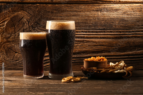 Glasses of dark beer and sn...