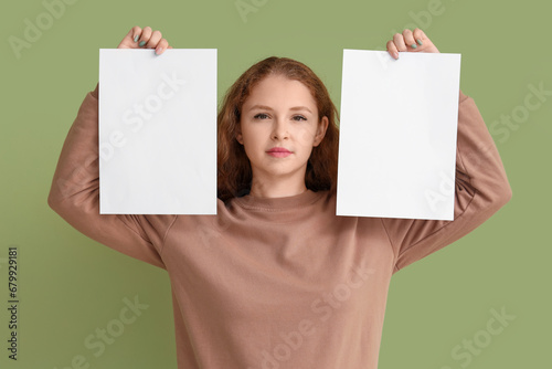 Young woman with blank pape...