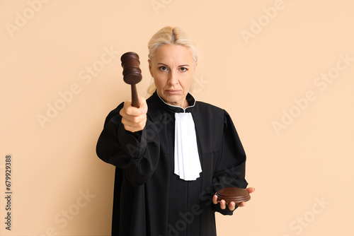 Mature judge with gavel on ...