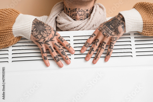 Young man with radiator on ...