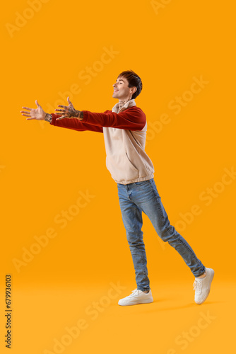 Young man opening arms for ...