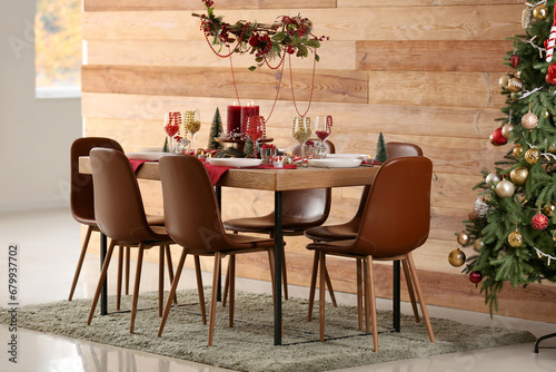 Festive dining table with Christmas setting and beads in room