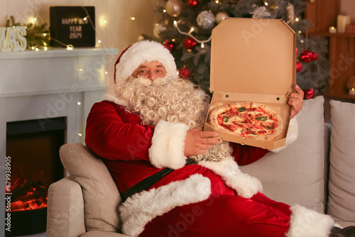 Santa Claus with tasty pizz...