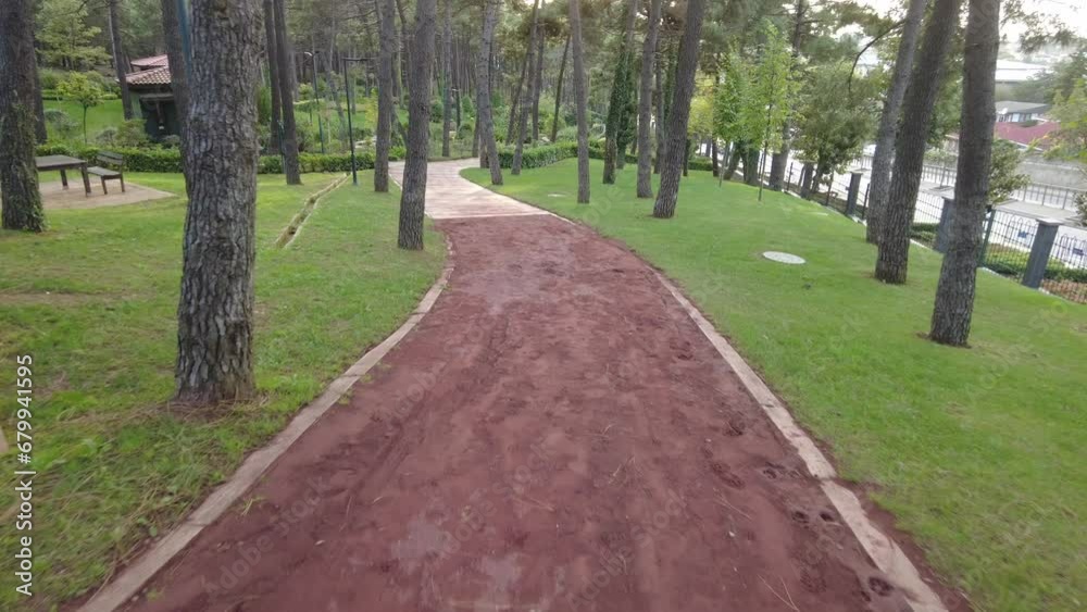 pov shot of walking on walkway at istanbul park at early morning pov shot of walking on walkway at istanbul park at early morning