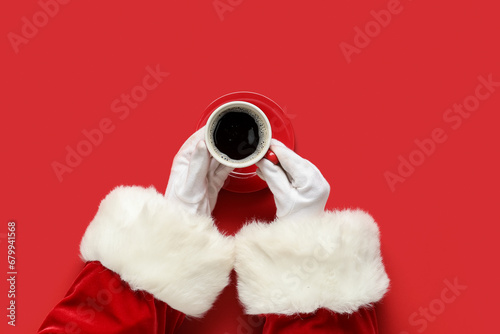 Santa Claus hands with cup ...