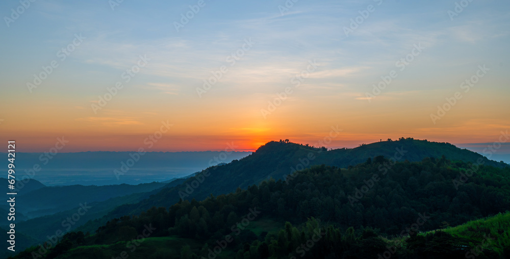 Landscape view of nive hills and mountain at sunset sky background.