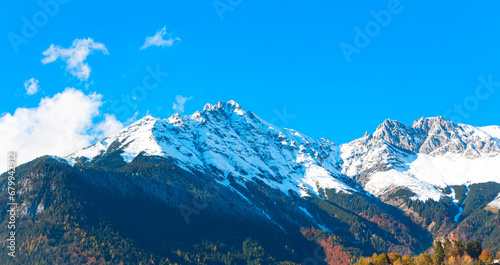 The mountain view of alpine as snow-capped mount peaks in Winter mountains scene © SASITHORN