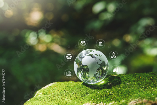 Crystal earth ESG concept ,Sustainable development goal (SDGs) Ideas Globe Glass on green Moss in forest business based Global communication network.