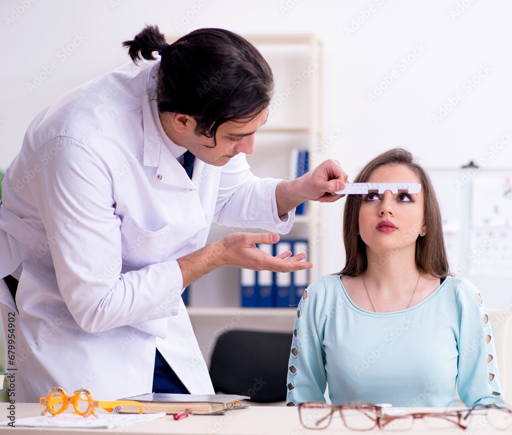 Young woman visiting male doctor oculist