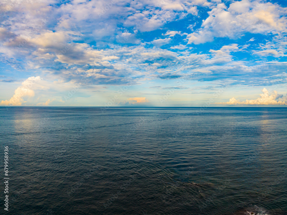 Obraz premium Amazing sunset or sunrise sky over sea landscape,Beautiful colorful light of nature seascape background,Drone aerial view ocean background