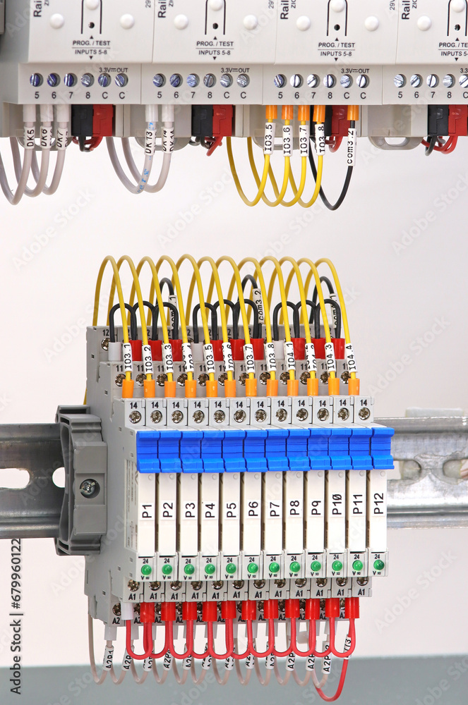 Ultra-thin electromechanical relay for connecting electrical loads in an electrical switchboard on a din rail.