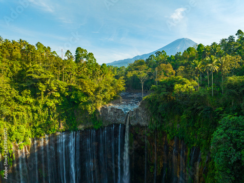 Aerial view of the Tumpak Sewu Waterfalls also known as Coban Sewu.Beautiful Tumpak Sewu Waterfalls are a tourist attraction in East Java, Indonesia.Amazing travel destination in asia photo