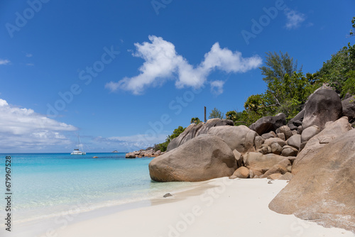 Anze Lazio, Praslin Island, Seychelles, and the typical granite stones. Tropical paradise, crystal clear tranquil waters, white sand, paradise on earth. Vacation mood, relaxation, serendipity. photo
