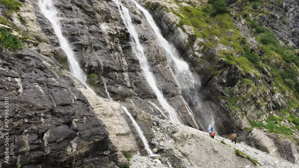 Several Streams A huge waterfall with several streams flowing down the rocks. White ...
