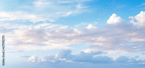 cloudscape. clouds in blue sky and reflection in sea or ocean. White cumulus clouds in sky over salt lake. mirror reflection of clouds in water  sunny summer day seascape panoramic