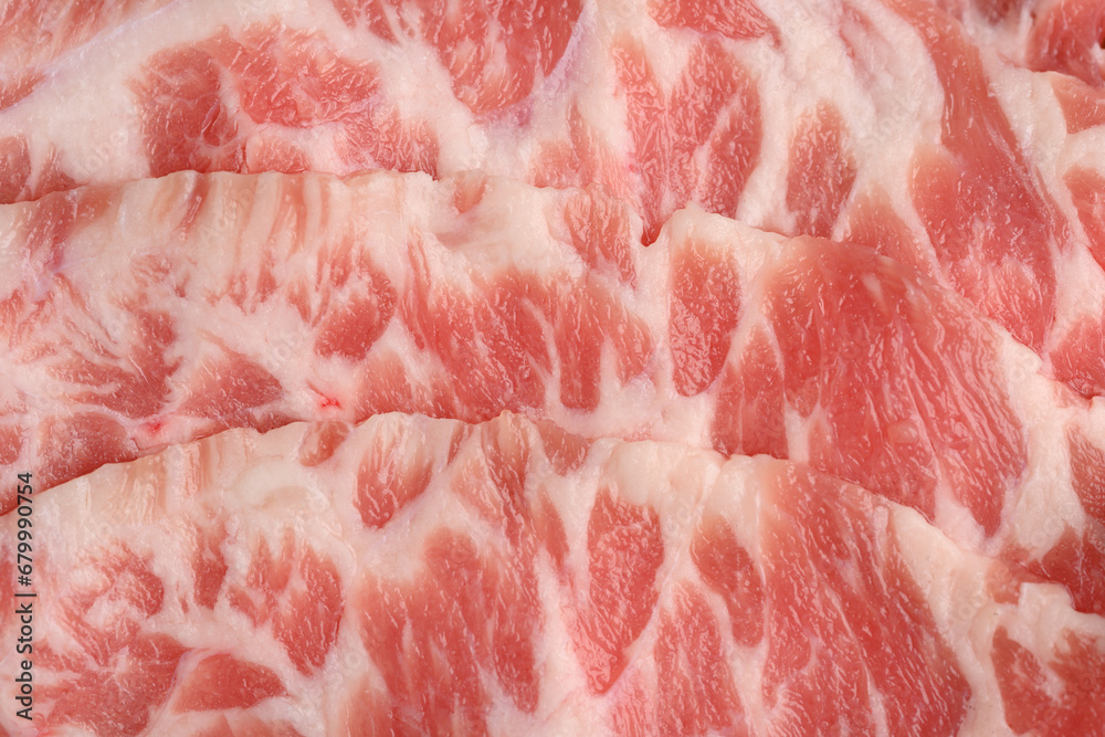 Close-up beef raw red steak on wooden board background.Meat texture. Close-up beef raw red steak on wooden board background.Meat texture.