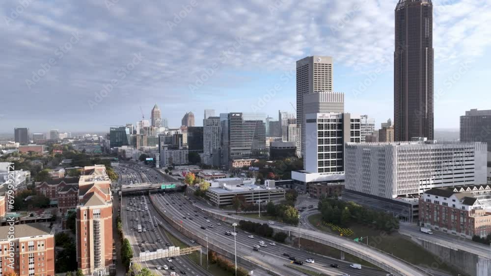 aerial push up atlanta georgia skyline an traffic on freeway