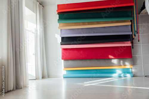 Lots of paper colorful backgrounds in white photo studio