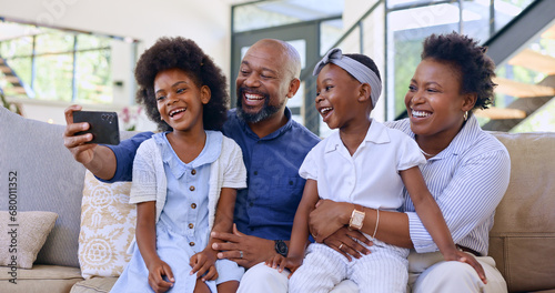 Selfie, happy family and children with smile in living room profile picture, social media or post. Black man, woman and girl with excitement for childhood memory, bonding and together on sofa in home photo