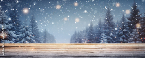 Wooden table with the snow and snowy small trees