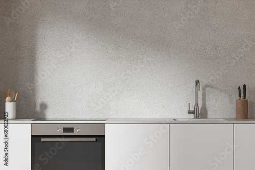 White kitchen interior with cabinets and sink