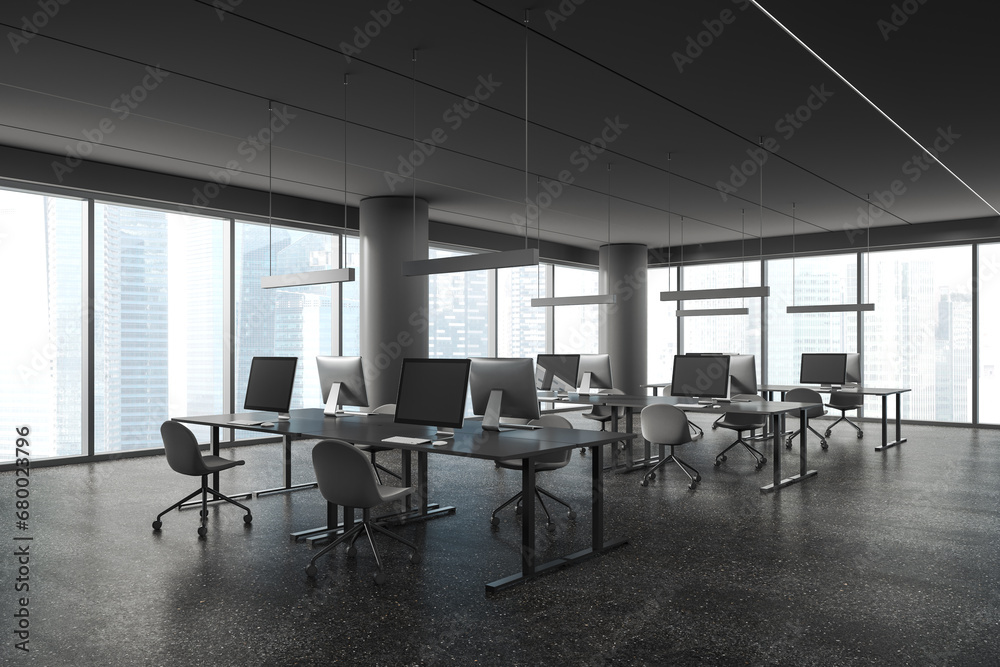 Modern office workplace interior with pc desktop and table in row near window Modern office workplace interior with pc desktop and table in row near window