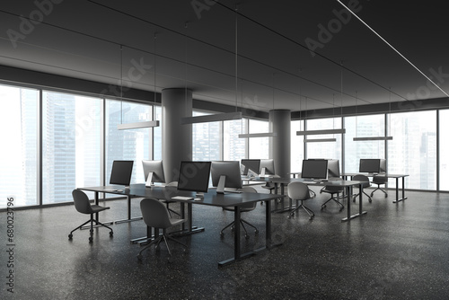 Modern office workplace interior with pc desktop and table in row near window