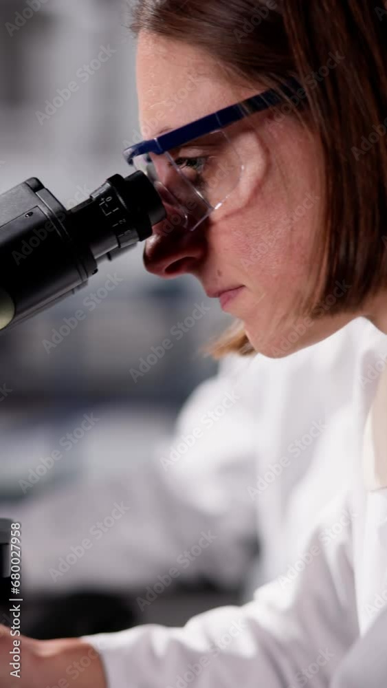 Innovative Doctor Conducting Research in Hospital Lab with Care Innovative Doctor Conducting Research in Hospital Lab with Care