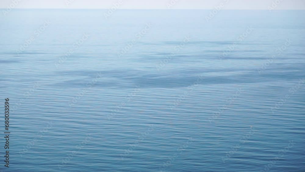 Aerial panoramic view of beautiful sunset above sea. Beautiful seascape. Sun glare, small waves on the water surface. Evening. Horizon. Nobody. No people. Never-ending beauty of nature. Aerial panoramic view of beautiful sunset above sea. Beautiful seascape. Sun glare, small waves on the water surface. Evening. Horizon. Nobody. No people. Never-ending beauty of nature.