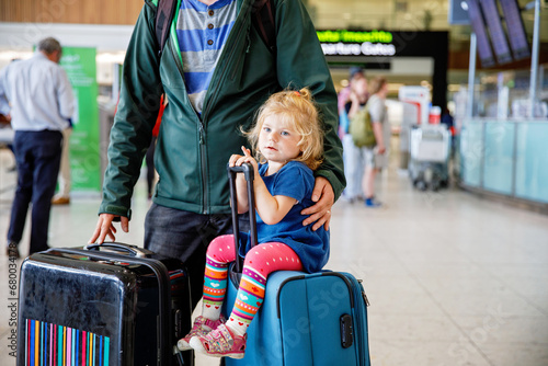 Photography Cute little toddler girl and father at the airport