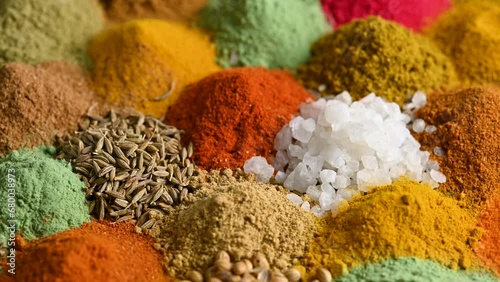 Assortment of Seasonings, condiments, Dry colorful spices rotate