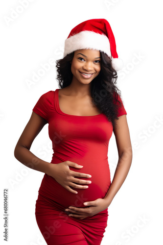 Front view of Smiley pregnant African woman in Santa hat gently touching her stomach isolated on transparent background. photo