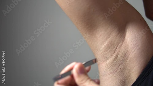 Waxing female body for hair removal by therapist close up. photo