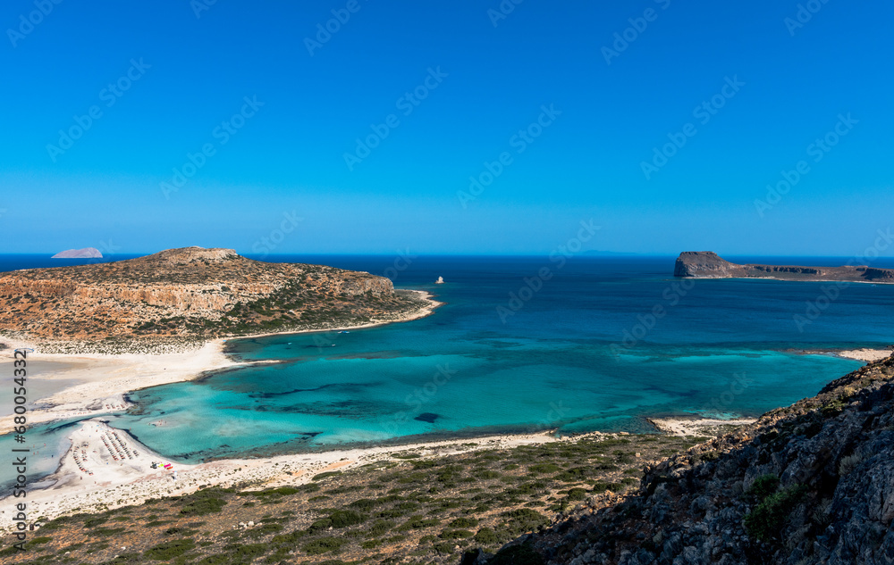 Blue lagoon in Balos, Crete, Greece. Beautiful lagoon at Mediterranean Sea. Balos Bay capture on the top of the mountain. View from above on a Gramvousa Island. Blue lagoon in Balos, Crete, Greece. Beautiful lagoon at Mediterranean Sea. Balos Bay capture on the top of the mountain. View from above on a Gramvousa Island.