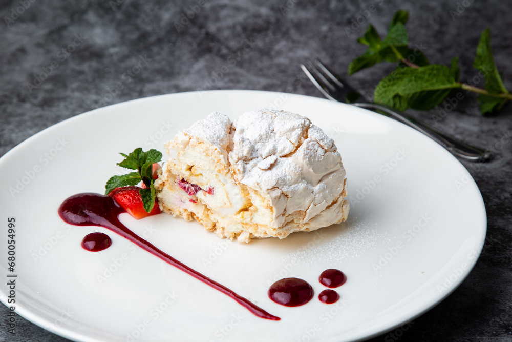 sweet sponge dessert with raspberries and powdered sugar side view sweet sponge dessert with raspberries and powdered sugar side view
