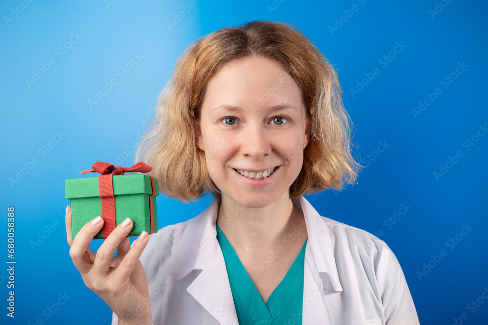 doctor with gift box, christmas discounts in medical clinics, gift certificates for health doctor with gift box, christmas discounts in medical clinics, gift certificates for health