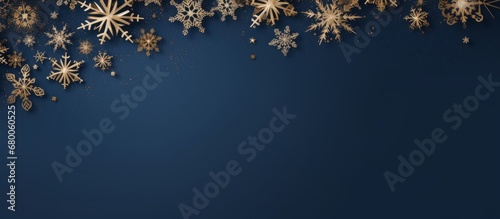 Copy space blue Christmas background with golden snowflakes on frame