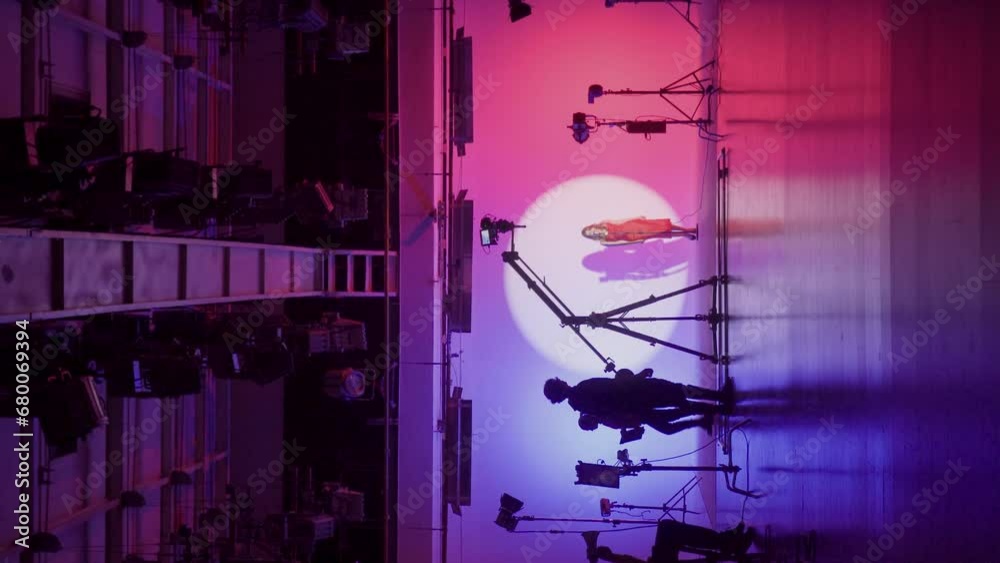 custom made wallpaper toronto digitalProfessional filming pavilion with a neon cyclorama. The process of preparing for the shooting of a music video. Director, Cameraman and crew in Backstage. Vertical video